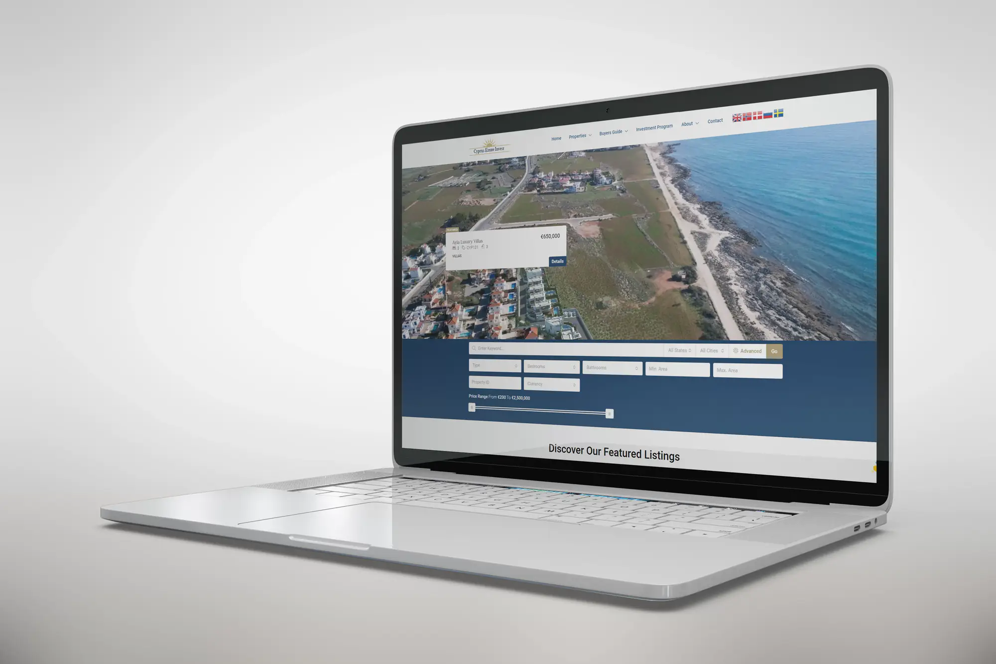 Cyprus Estate Invest home page on a laptop: beach photo and listing search